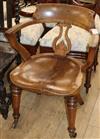 A Victorian oak and elm desk chair                                                                                                     