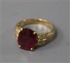 A modern 14ct gold ruby and diamond set dress ring, size O.                                                                            