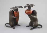 A pair of Japanese bronze 'rat' candlesticks, Meiji period, 16cm and 17cm high                                                         