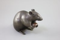 A Japanese bronze model of a rat holding a chestnut, Meiji period, 17cm long                                                           