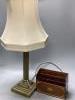 A brass corinthian table lamp and an Edwardian inlaid mahogany letter rack                                                                                                                                                  