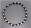 A cultured pearl, lapis lazuli bead necklace with 14ct gold clasp, 39cm.                                                               