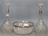 A pair of silver collared cut glass decanters and a similar bowl                                                                       