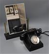 A Christian Dior advertising mirror and a black bakelite telephone                                                                     