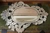 A Venetian style etched wall mirror W.65cm                                                                                             