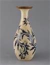 George Tinworth for Royal Doulton, a foliate and vermicular decorated bottle vase, c.1905, 27cm                                        