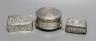 A modern silver mounted trinket box,82mm and two late Victorian embossed silver small boxes.                                                                                                                                
