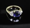 An 18ct gold, synthetic sapphire and heart shaped diamond ring, size M.                                                                