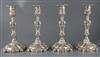 An ornate set of four Victorian rococco style silver candlesticks, Creswick & Co (Thomas James & Nathaniel Creswick) 29cm.             