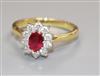 A modern 18ct gold, ruby and diamond cluster ring, size L.                                                                             