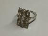 A mid 20th century 18ct white metal and diamond cluster set tablet ring                                                                                                                                                     