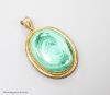 A Victorian yellow metal and malachite set oval pendant, with glazed back, overall 56mm                                                                                                                                     