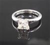 A modern 18ct white gold and solitaire princess cut diamond ring, size M.                                                              