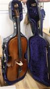 A cased cello with bow                                                                                                                 