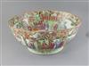 A large Chinese Canton-decorated famille rose punch bowl, c.1830, W.41.5cm, section broken and restuck, and two hairline cracks        