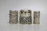 Two Edwardian silver mounted scent bottles, London, 1907, tallest 69mm and a silver embossed box and cover.                                                                                                                 