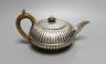 A George IV fluted silver teapot, Emes & Barnard, London, 1825, gross 13.5 oz.                                                                                                                                              