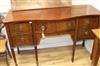 A mahogany inlaid serpentine sideboard, W.138cm                                                                                        