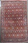 A Persian red ground carpet, 11ft x 7ft 11in.                                                                                          