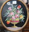 An oval reverse painting on glass of an urn of flowers, 33 x 27cm                                                                      