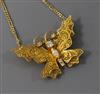 An 18ct gold and diamond set filligree butterfly pendant on chain, from The House of Igor Carl Faberge, Geneva, pendant width 39mm.    