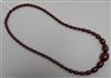 A single strand graduated simulated amber necklace, gross 53 grams, 74cm.                                                              