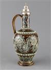 George Tinworth for Doulton Lambeth, a scroll and flowerhead design silver-topped ewer, dated 1874, 30cm                               