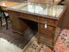 A Georgian style walnut desk with triple skiver, width 123cm depth 72cm height 74cm                                                                                                                                         