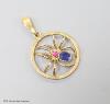 A 9ct, sapphire and ruby set circular spider pendant, 19mm, gross weight 1.9 grams.                                                                                                                                         