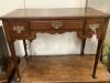 A George III mahogany lowboy fitted three short drawers, width 92cm depth 50cm height 69cm                                                                                                                                  