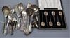 A group of small silver flatware including a Victorian sifter spoon, christening pair etc and a pair of pepperettes.                   