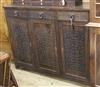 A carved oak sideboard, Art and Crafts style W.147.5cm                                                                                 