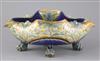 Frank A Butler for Doulton, a rare quatrefoil dish on four paw feet, dated 1882, W. 28cm, restoration                                  