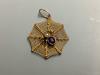 A 9ct, amethyst and seed paerl set 'spider in web' pendant                                                                                                                                                                  