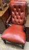 A Victorian mahogany easy chair, upholstered in buttoned red hide                                                                                                                                                           