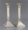 A pair of Edwardian silver corinthian column candlesticks, W.W. Harrison & Co, 19.5cm.                                                 