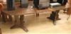 An oak extending dining table W.235cm extended                                                                                         