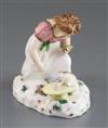 A Rockingham porcelain group of a kneeling girl playing with a kitten, c.1830, h. 10.5cm, small losses                                 