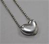 A George Jensen sterling silver heart pendant on chain, numbered 2009, in Georg Jensen box.                                            
