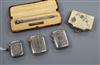 Three assorted silver vesta cases, a cased sterling pencil and a purse.                                                                