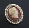 A 19th century gold, diamond and split pearl mounted oval hardstone cameo pendant brooch, 45mm.                                        