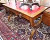 A Victorian walnut writing table in the style of Pugin                                                                                 