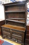 An 18th century oak mule chest, later carved and converted to a dresser W.126cm                                                        