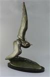 Irene Rochard. An Art Deco bronze model of a seagull flying over a wave, height 27.5in.                                                