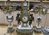 A gilt metal and marble clock garniture, mounted with cherubs height 61cm                                                              