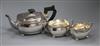 A George V silver three-piece tea service of rectangular form, gross 28.5 oz.                                                          