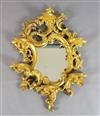 A 19th century Florentine giltwood wall mirror, W.2ft 2in. H.3ft                                                                       