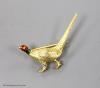 An early 20th century 9ct and polychrome enamel pheasant brooch, 42mm, gross weight 6.4 grams.                                                                                                                              