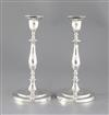 A pair of George III silver candlesticks, 28.5cm.                                                                                      