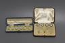 A set of four 18ct, mother of pearl, enamel and seed pearl set buttons, gross 7.2 grams, two similar 15ct studs, gross 2.3 grams and one other cased set of white metal dress studs.                                        